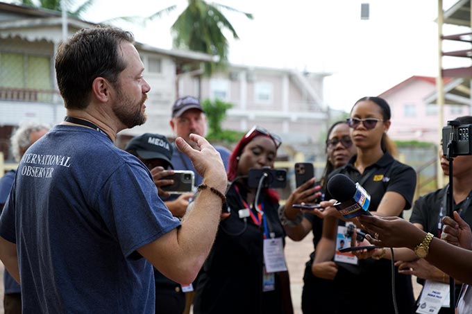 Jason speaks to reporters.