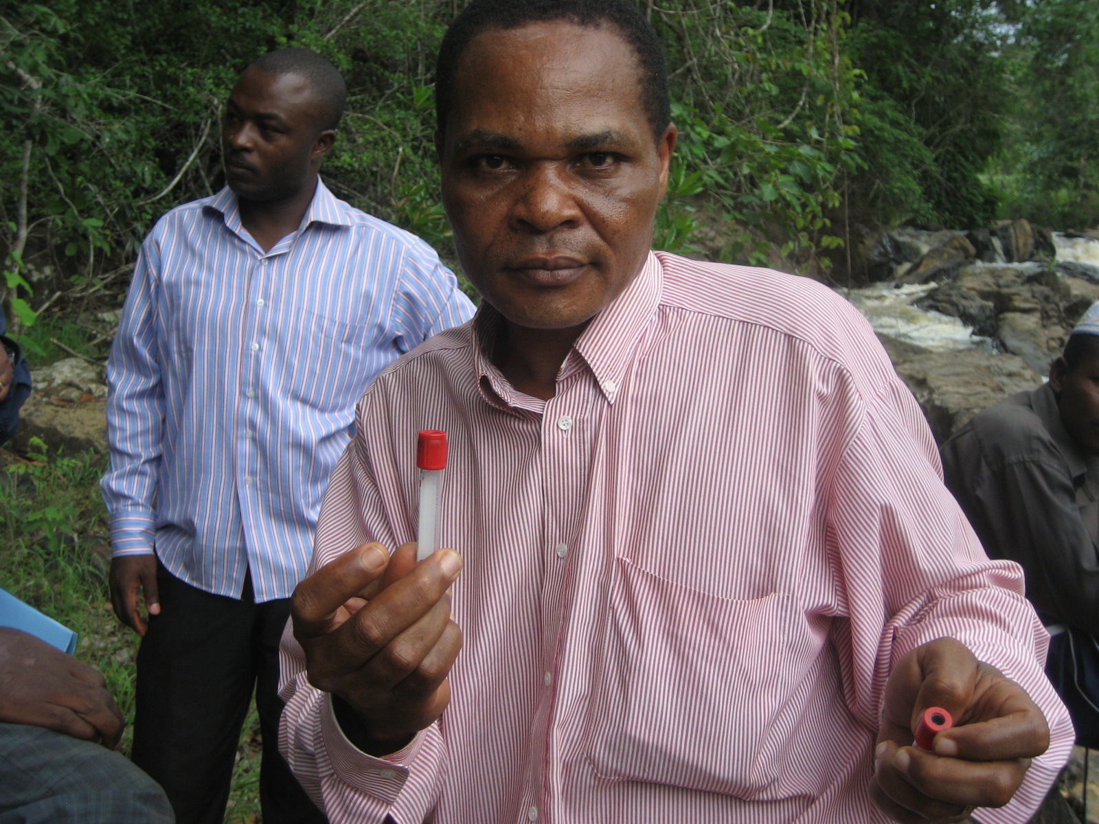 Massangam Health District Assistant Medical Officer with flies