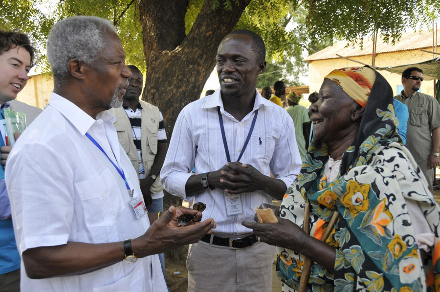 Former U.N. Secretary General Kofi Annan talks with a woman after she has voted on Jan. 9.  Annan is leading the Carter Center's observation delegation along with former U.S. President Jimmy Carter, former Tanzania Prime Minister Joseph Warioba, and Dr. John Hardman, Carter Center president and CEO.