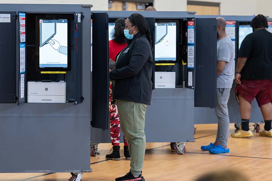 Woman at a voting booth