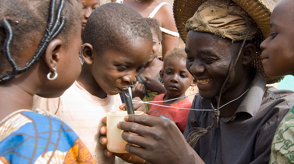 Learning to use pipe filters in Ghana.