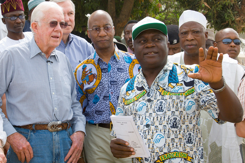 Dr. Miri explains some facts about health programs in Nigeria to President Carter during a 2007 visit to Nasarawa state.