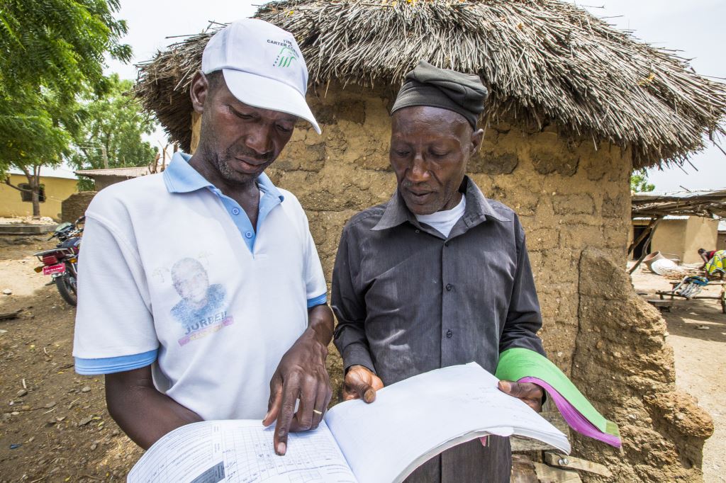 Volunteer community drug distributors, like these men in Amper in Nigeria’s Plateau state, are key to eliminating neglected tropical diseases like river blindness. =