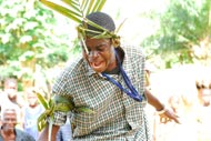 A drama club member acts out the process of sassywood, or trial by ordeal, a common practice in rural Liberia.