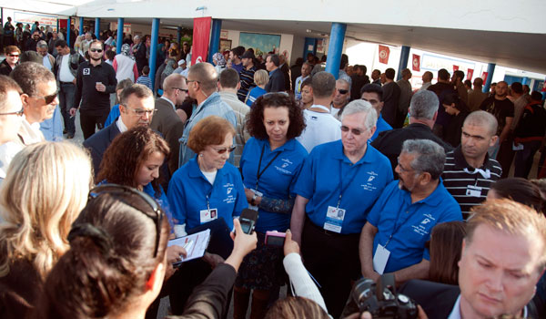 Carter Center delegation leaders Mrs. Carter; Dr. John Hardman, Carter Center president and CEO; and former Mauritius President and Club of Madrid member Cassam Uteem address the media at a Tunis polling center.